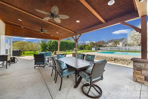 a view of a patio with a backyard