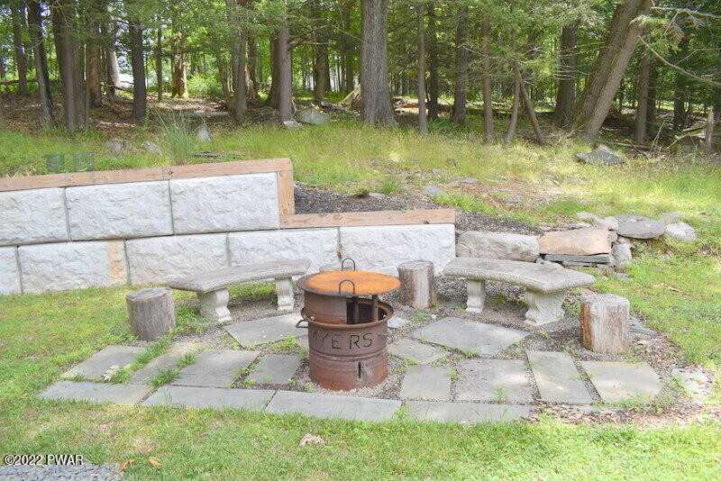 549 Finn Swamp Road Lakeville, PA 18438 - Photo 23 of 35 a view of a patio with chairs and a table and chairs