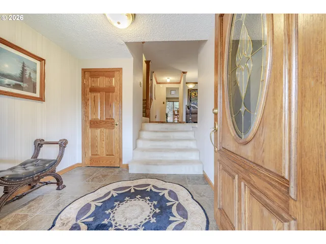 a view of a livingroom with furniture and a window