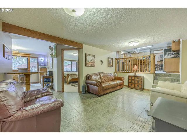 a living room with furniture and a table