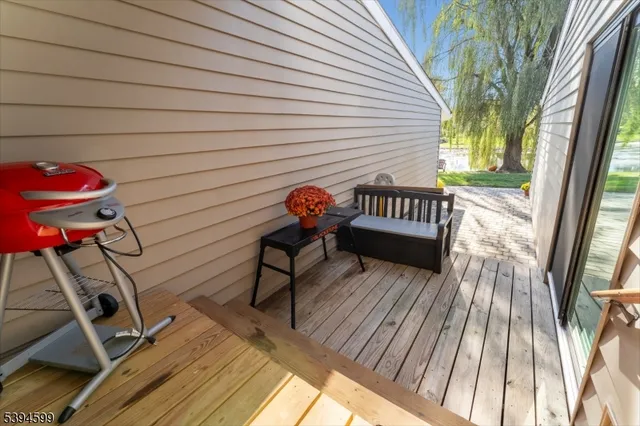 a view of a wooden deck with a bench