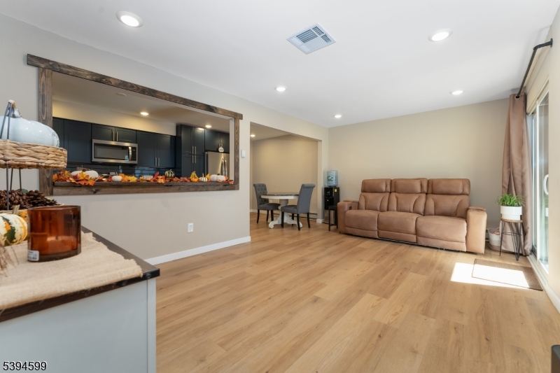 89 North Slope Clinton, NJ 08809 - Photo 14 of 21 a living room with furniture and kitchen view
