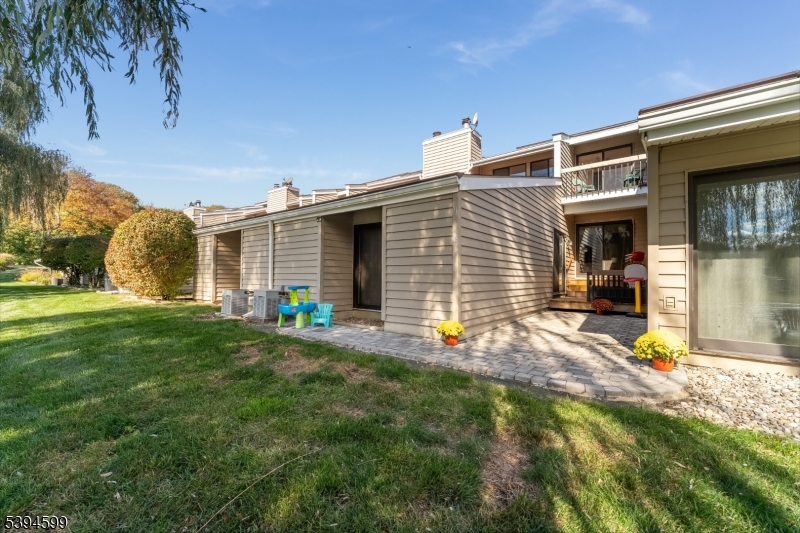 89 North Slope Clinton, NJ 08809 - Photo 19 of 21 a view of a house with a backyard and a tree