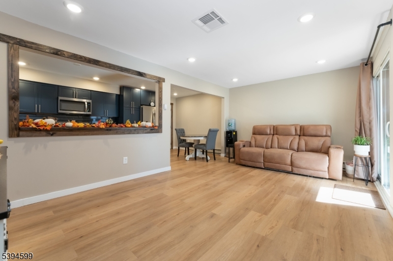 89 North Slope Clinton, NJ 08809 - Photo 4 of 21 a living room with furniture and kitchen view