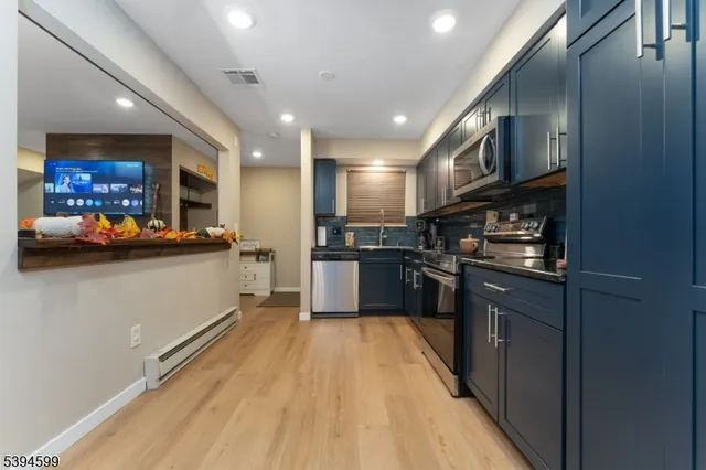 a kitchen with stainless steel appliances granite countertop lots of counter top space