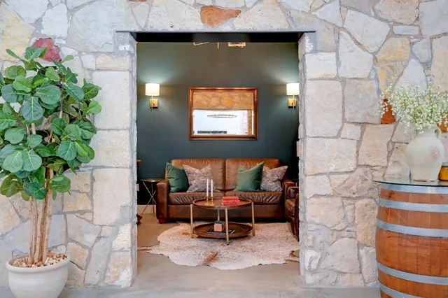 a living room with furniture and a potted plant