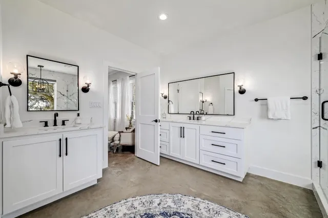 a room with a bed and a mirror