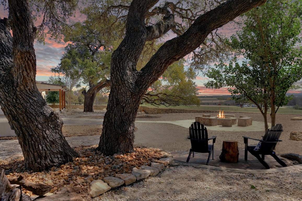 1668 Rocky Road Blanco, TX 78606 - Photo 2 of 33 a view of a backyard with large trees
