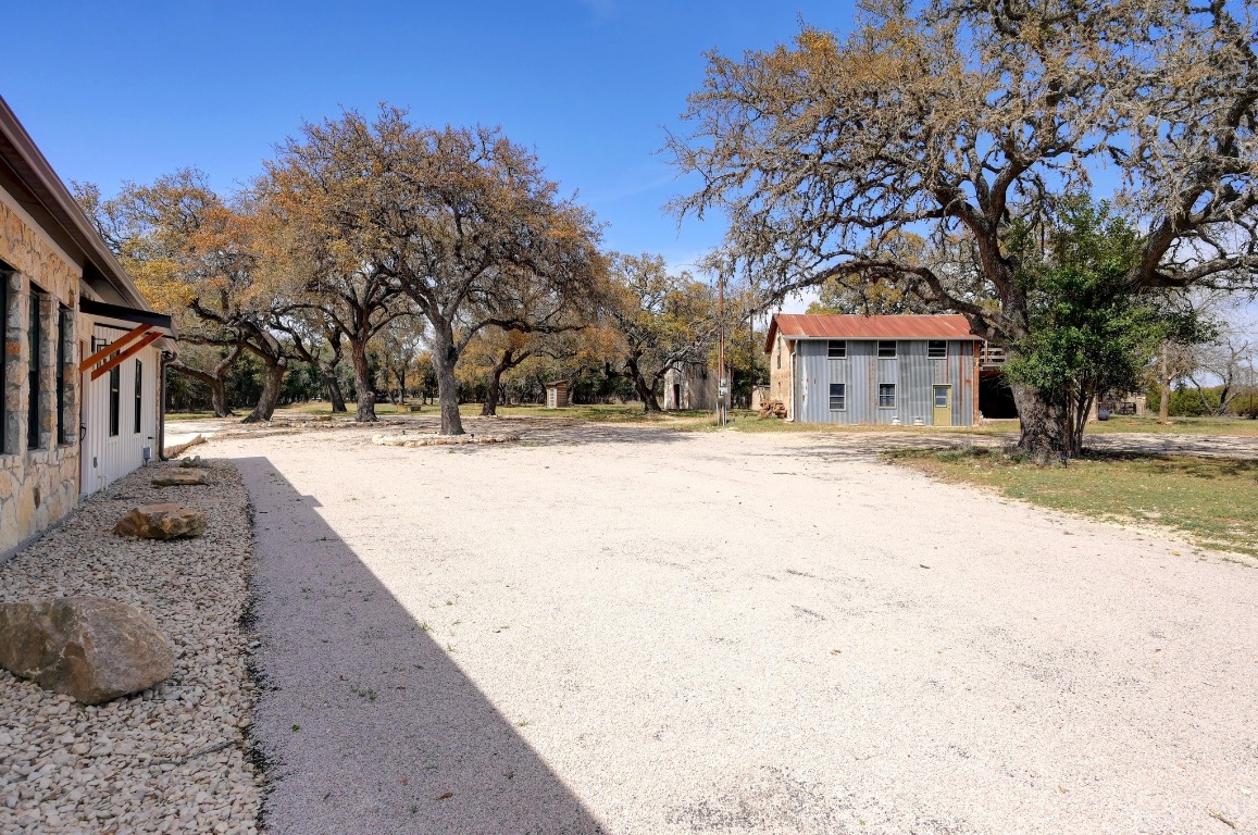 1668 Rocky Road Blanco, TX 78606 - Photo 26 of 33 a view of a white house with a yard