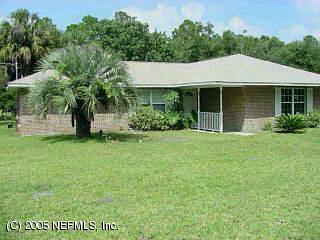 3625 Maranatha Road Yulee, FL 32097 - Photo 1 of 1 a view of a house with garden and yard