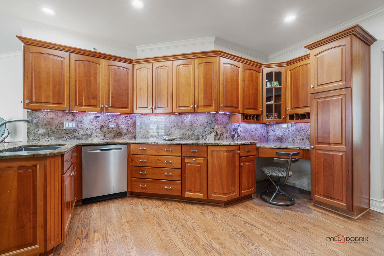 2307 Old Hicks Road Long Grove, IL 60047 - Photo 15 of 59 a kitchen with stainless steel appliances granite countertop wooden cabinets a table and chairs