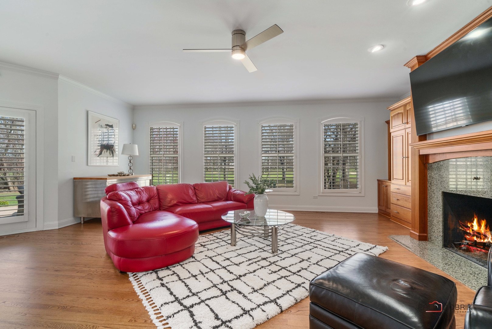 2307 Old Hicks Road Long Grove, IL 60047 - Photo 19 of 59 a living room with furniture a flat screen tv and a fireplace