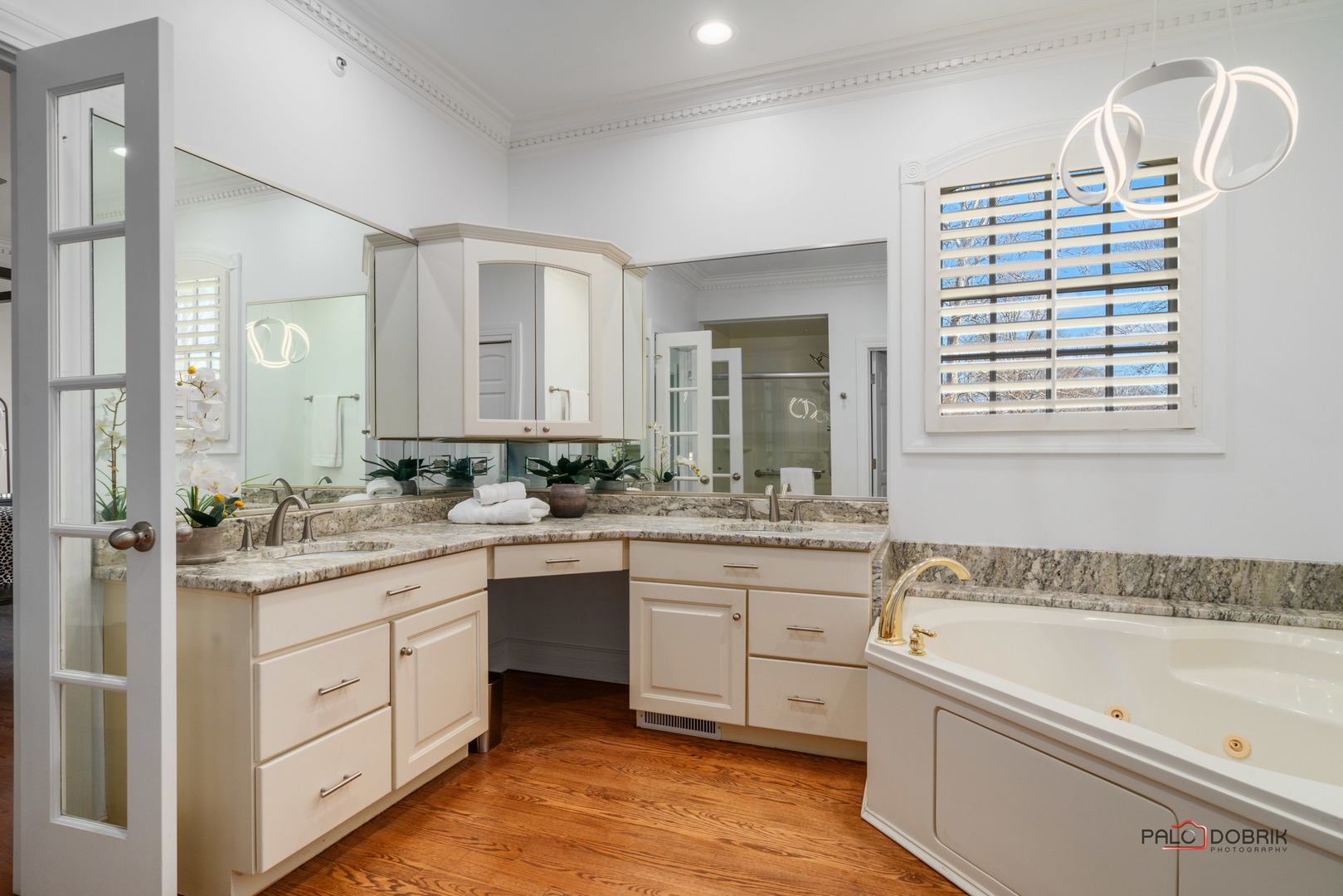 2307 Old Hicks Road Long Grove, IL 60047 - Photo 23 of 59 a spacious bathroom with a granite countertop sink mirror and a bathtub