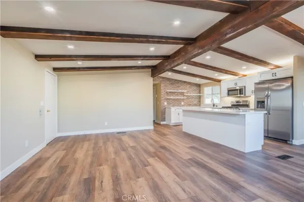 a view of kitchen with wooden floor