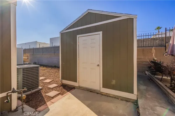 a view of backyard with cabin