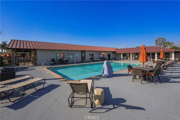 a view of a swimming pool with sitting area
