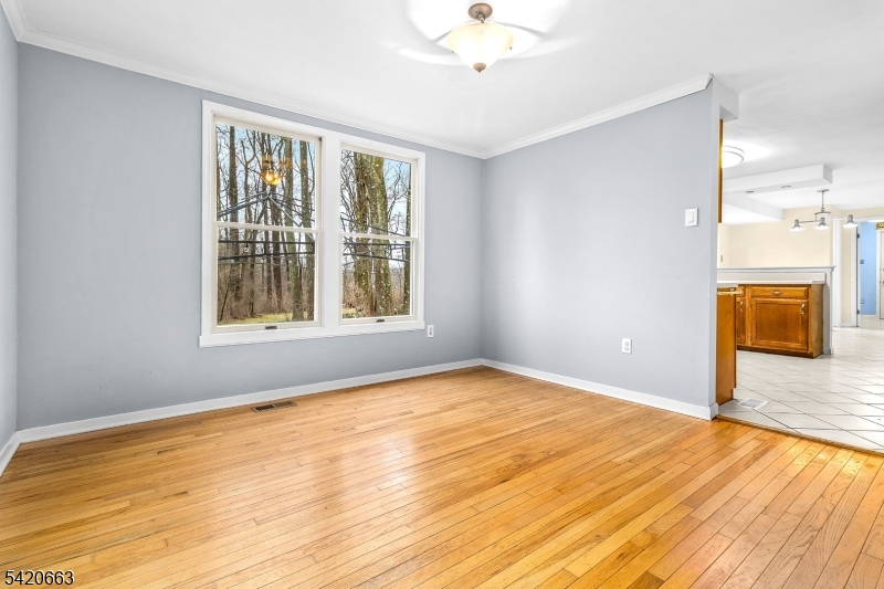 382 Mine Road Asbury, NJ 08802 - Photo 6 of 30 a view of an empty room with a window and wooden floor