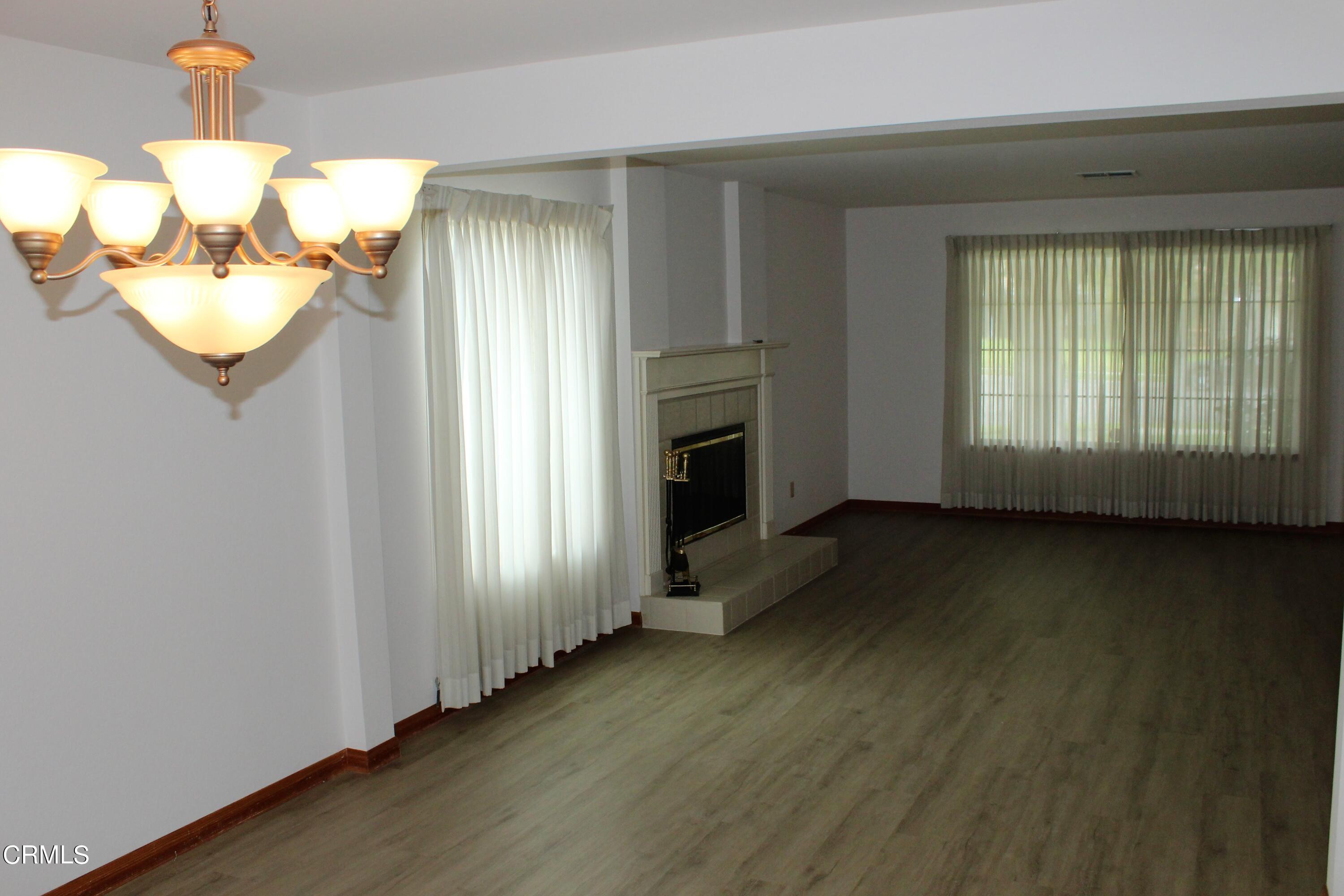 2202 Firestone Court Oxnard, CA 93036 - Photo 17 of 51 an empty room with wooden floor and windows