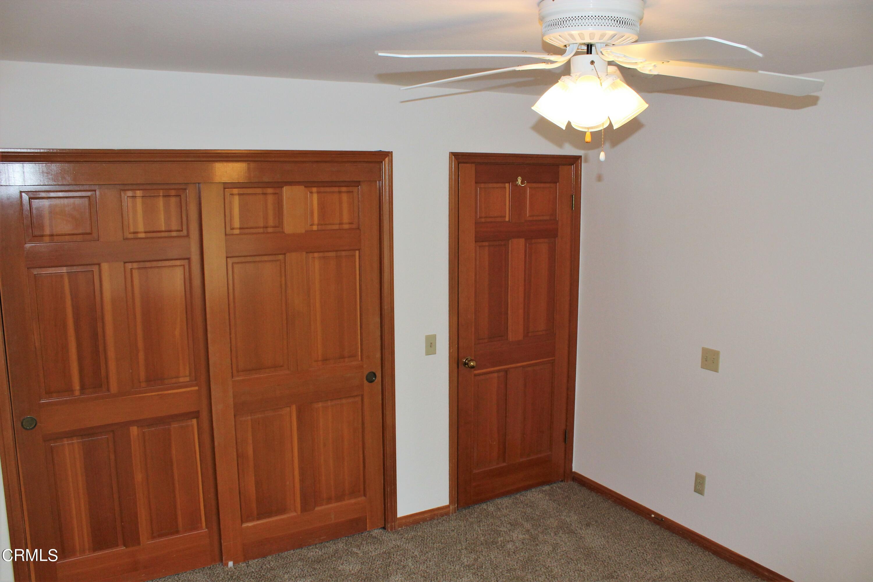 2202 Firestone Court Oxnard, CA 93036 - Photo 28 of 51 an empty room with chandelier fan