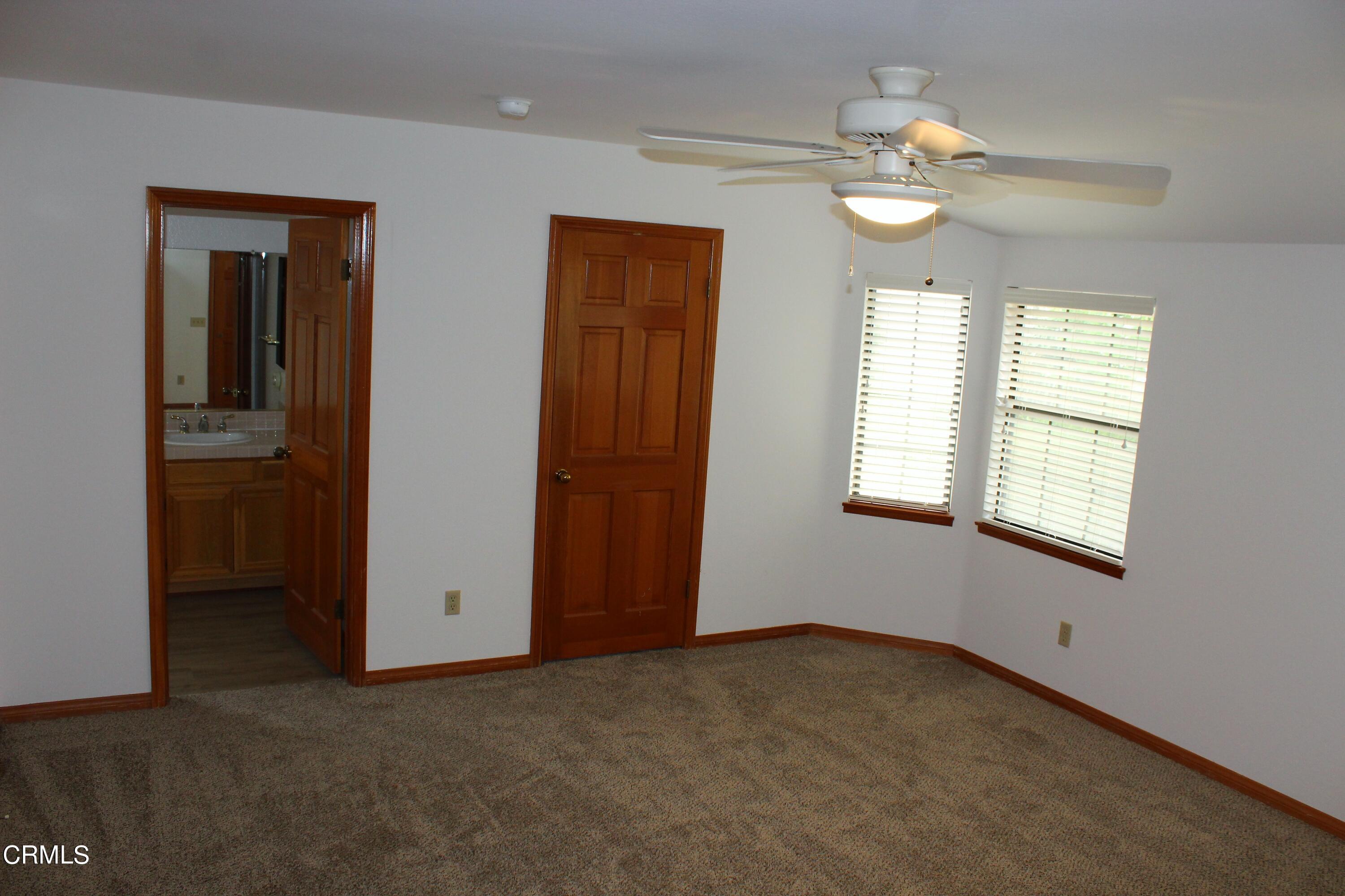 2202 Firestone Court Oxnard, CA 93036 - Photo 36 of 51 an empty room with windows and fan