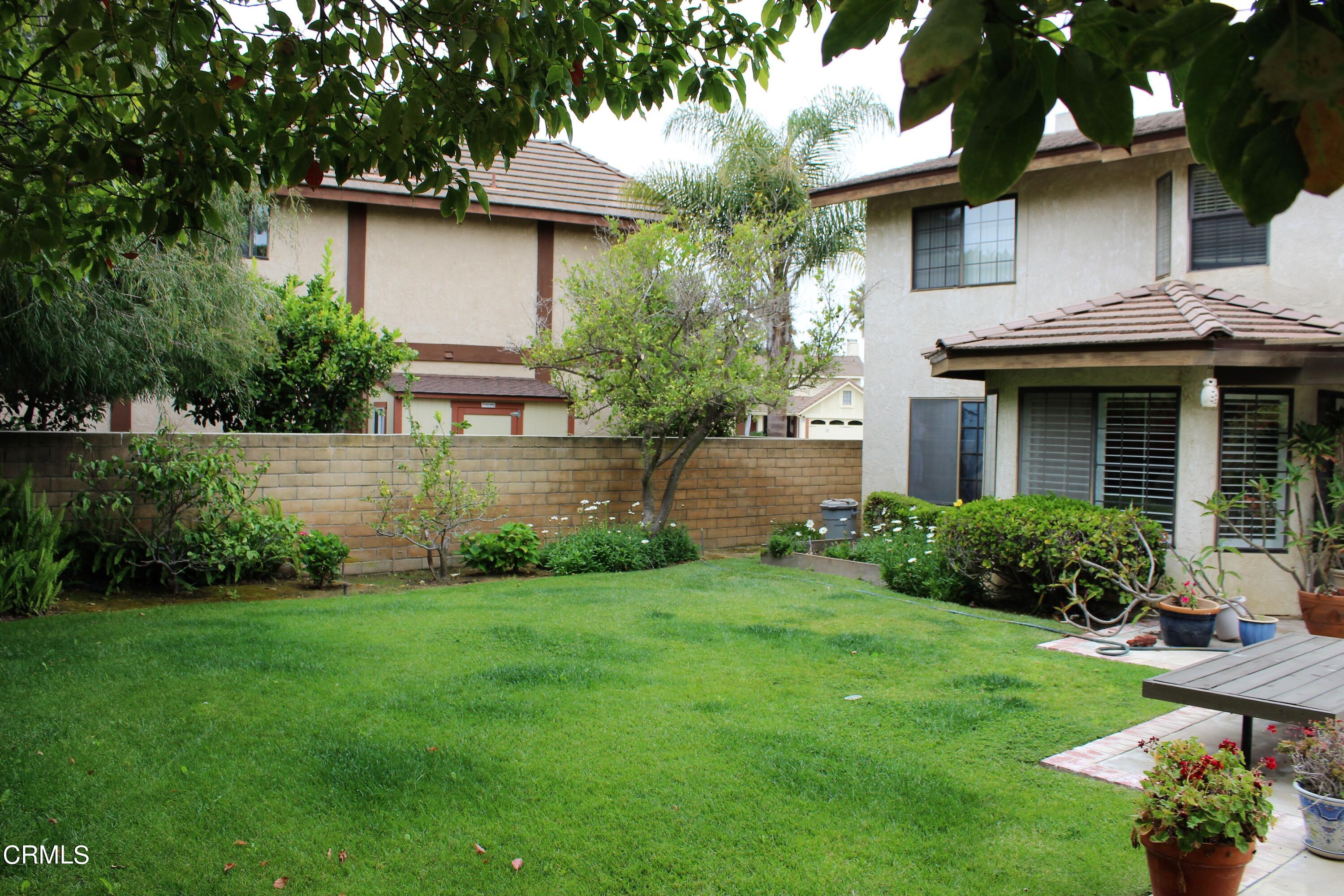 2202 Firestone Court Oxnard, CA 93036 - Photo 46 of 51 a view of a house with a yard and a large tree