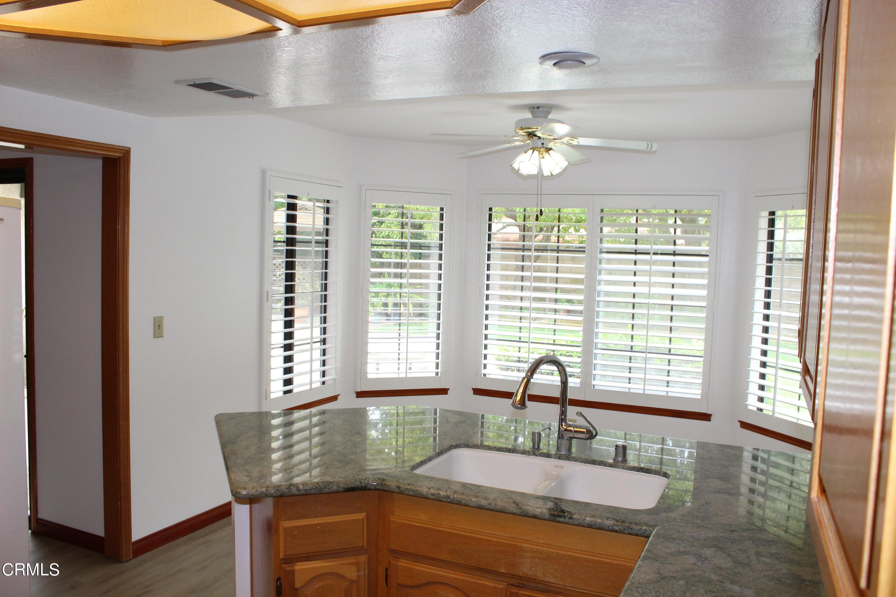 2202 Firestone Court Oxnard, CA 93036 - Photo 9 of 51 a dining table with chairs and natural light