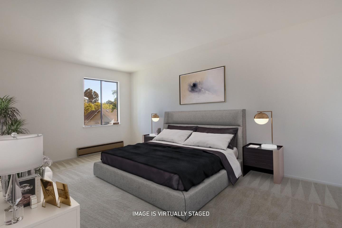 500 Almer Road, Unit 301 Burlingame, CA 94010 - Photo 11 of 24 a bedroom with a bed and a chair