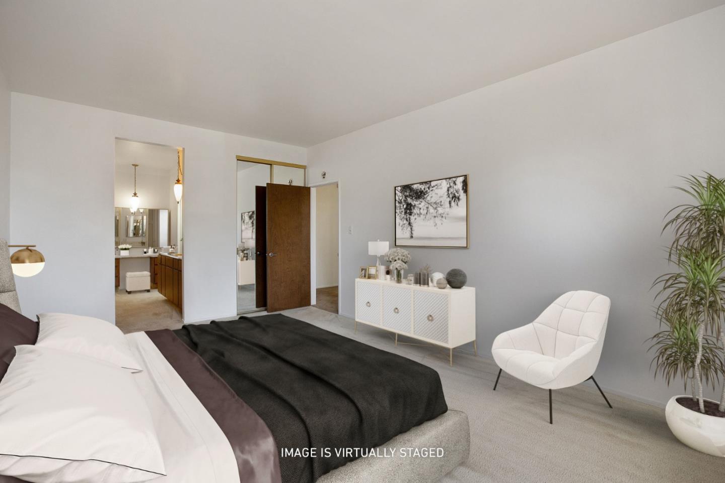 500 Almer Road, Unit 301 Burlingame, CA 94010 - Photo 13 of 24 a bedroom with a bed and a chair