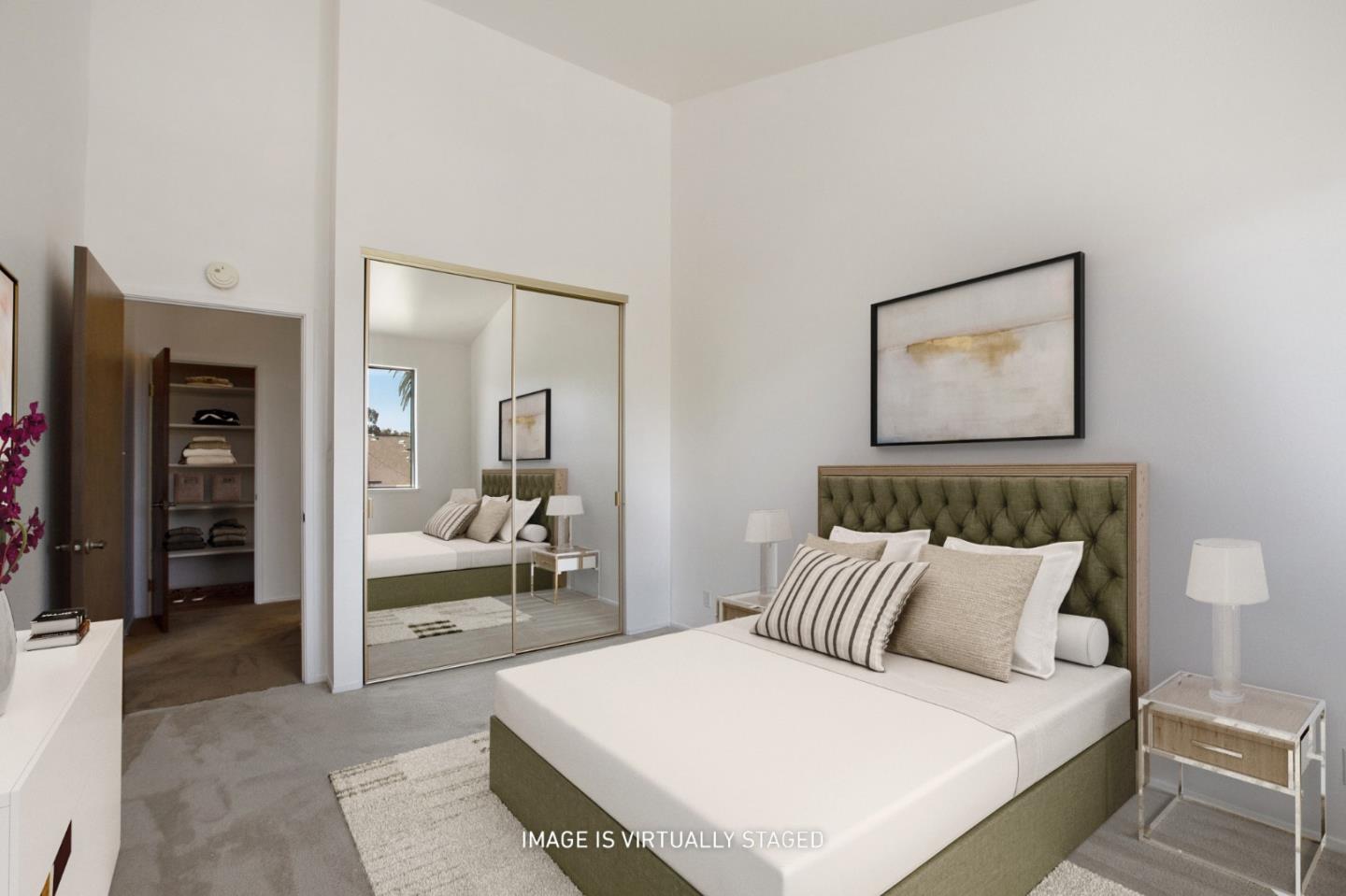 500 Almer Road, Unit 301 Burlingame, CA 94010 - Photo 17 of 24 a bedroom with a large bed and a couch