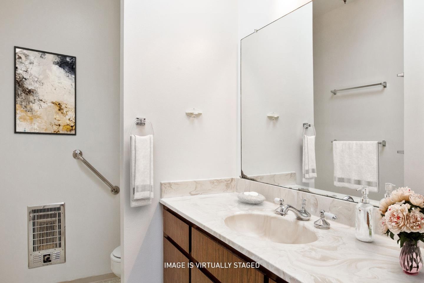 500 Almer Road, Unit 301 Burlingame, CA 94010 - Photo 19 of 24 a bathroom with a granite countertop sink and a mirror