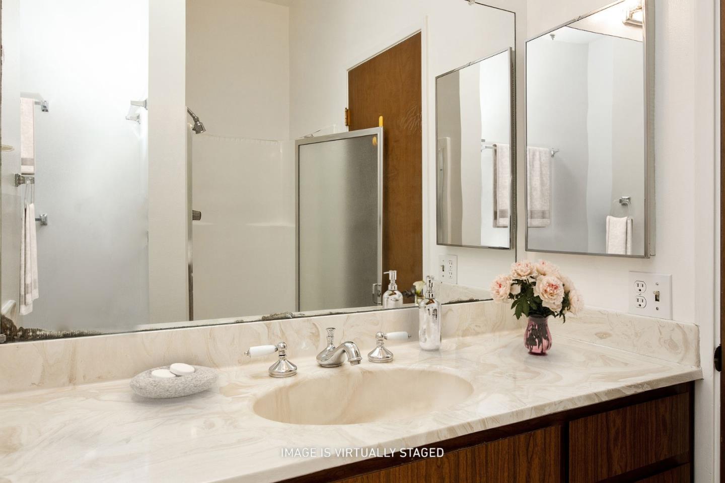 500 Almer Road, Unit 301 Burlingame, CA 94010 - Photo 20 of 24 a bathroom with a sink and a mirror