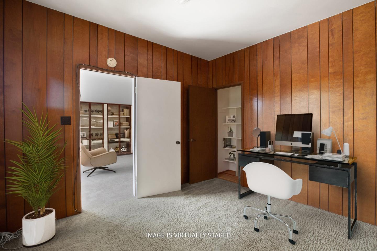 500 Almer Road, Unit 301 Burlingame, CA 94010 - Photo 23 of 24 a living room with furniture a flat screen tv and a potted plant