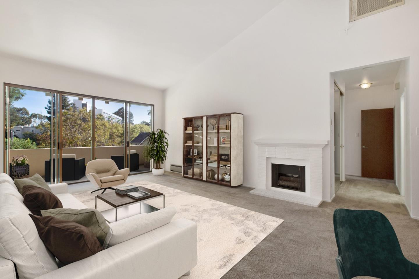 500 Almer Road, Unit 301 Burlingame, CA 94010 - Photo 3 of 24 a living room with furniture large window and fireplace