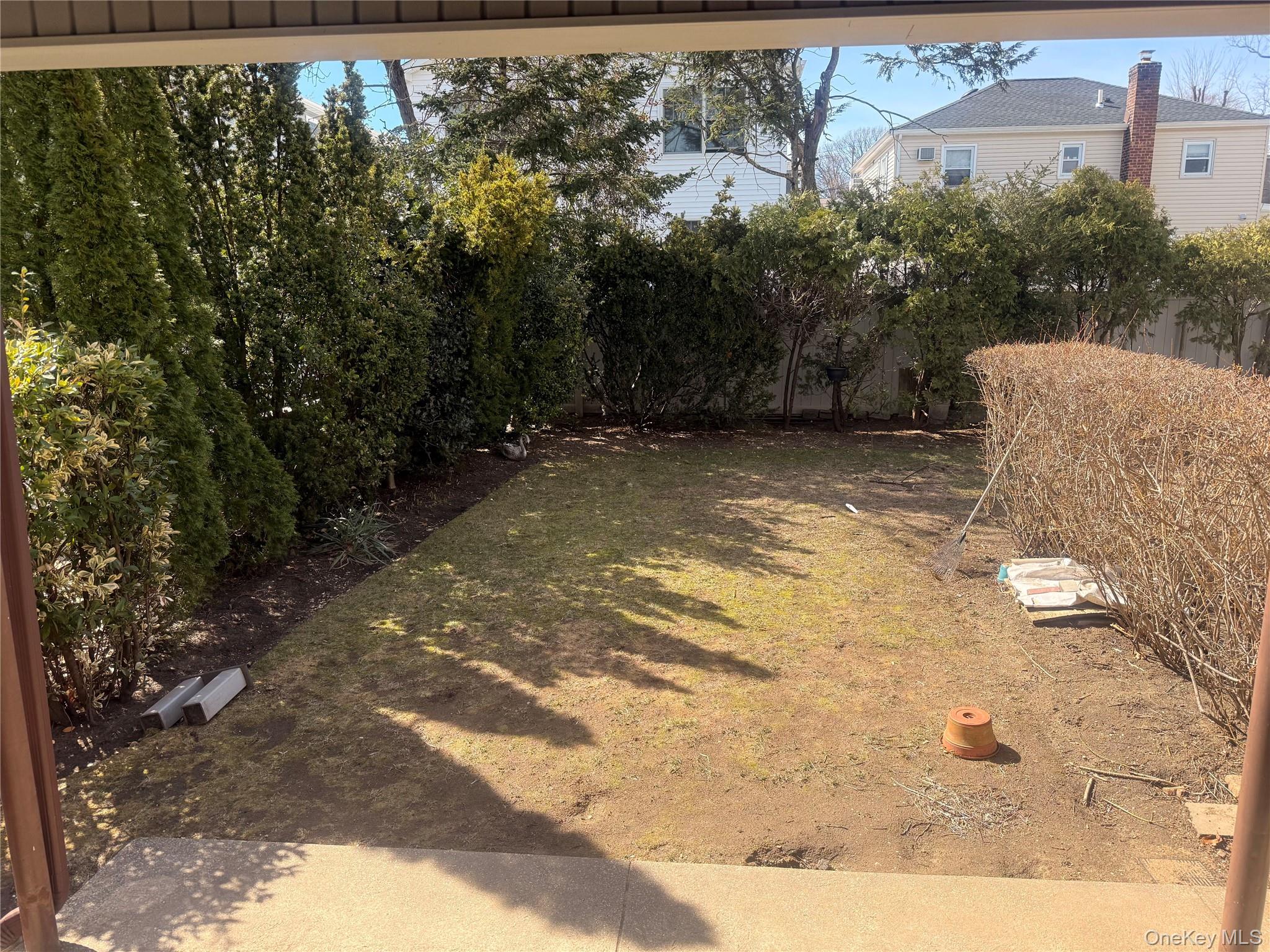 53 Kirkwood Road, Unit LEFT Port Washington, NY 11050 - Photo 14 of 15 Private Yard with Patio