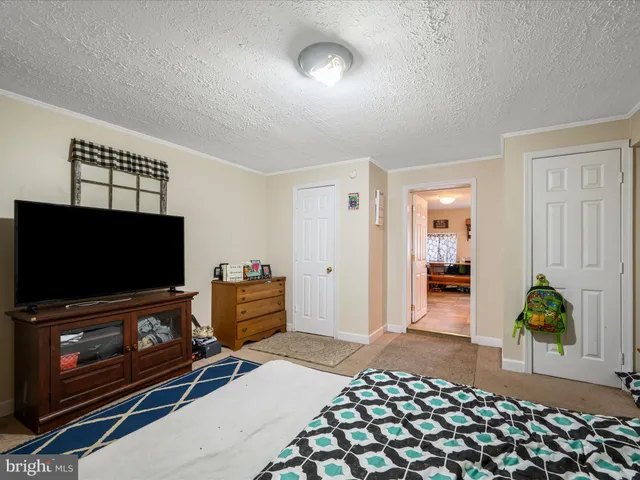 a bedroom with a bed and a cabinets