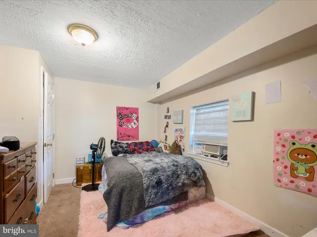 a kitchen with sink refrigerator and cabinets