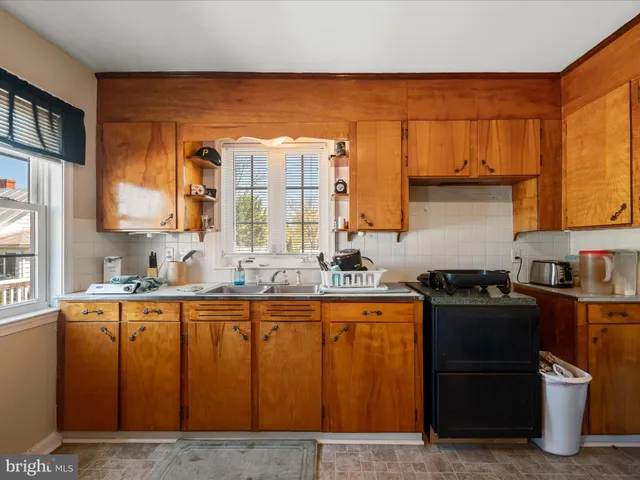 a bed room with a bed and a wooden floor
