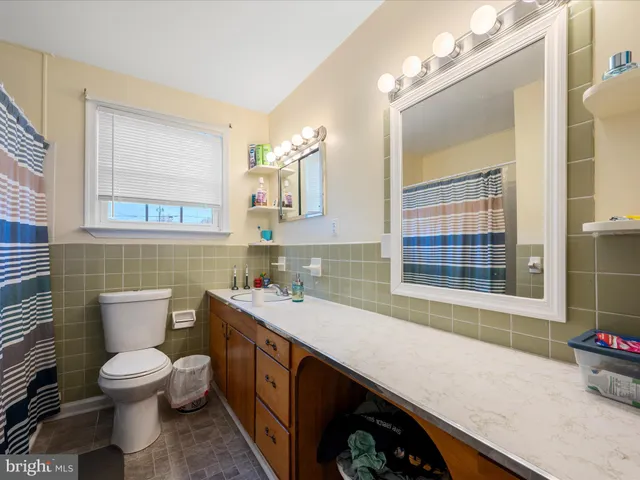 a view of a house with a yard and deck