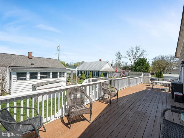 a large kitchen with stainless steel appliances kitchen island granite countertop a sink and cabinets