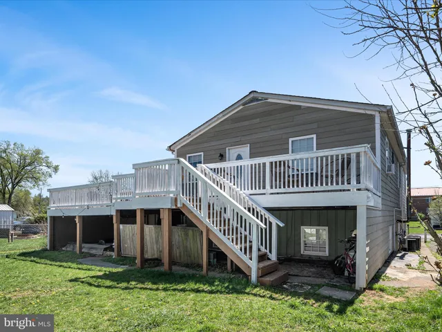 a bathroom with a sink a toilet and shower curtain