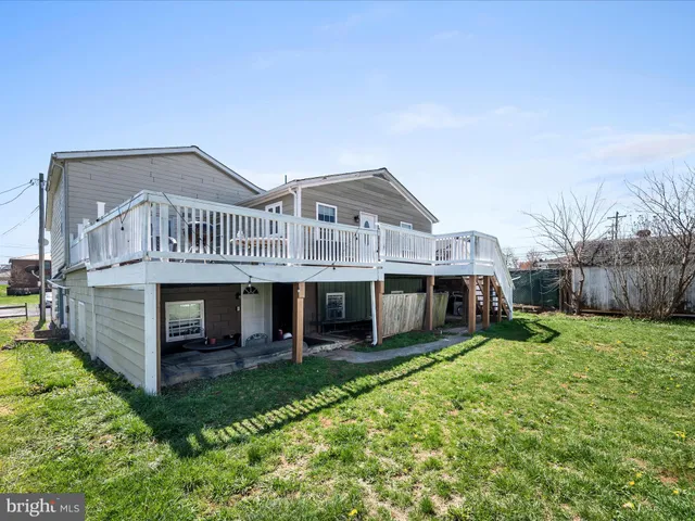 a view of a livingroom with furniture and a flat screen tv