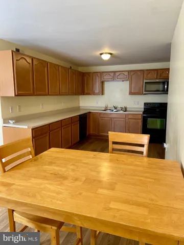 a view of a room with workspace and a window