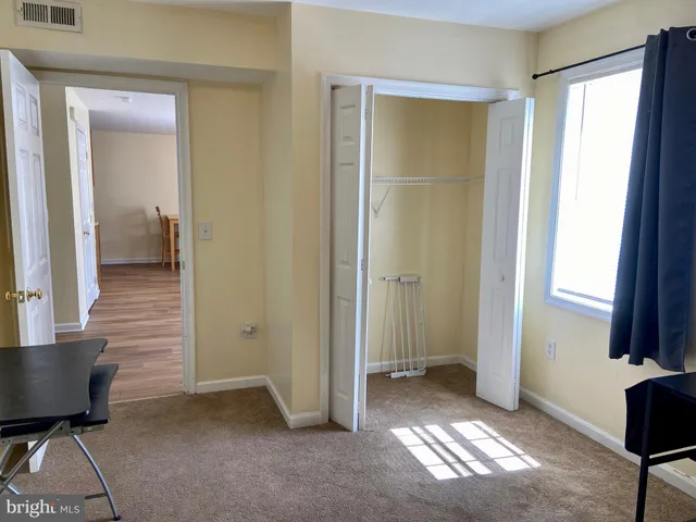 a kitchen with a sink a stove and cabinets