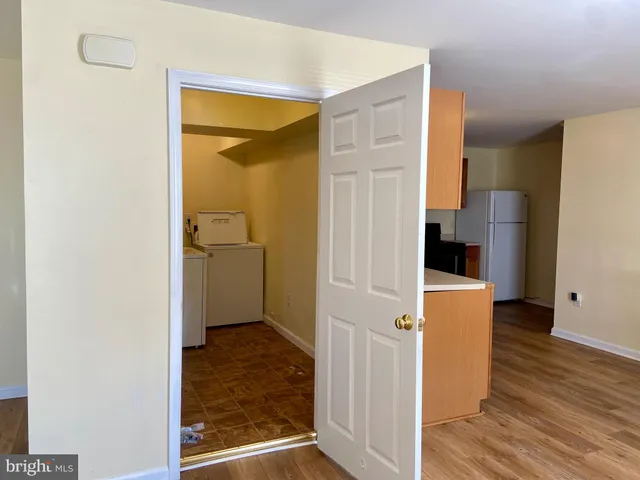 a bedroom with a bed and a desk