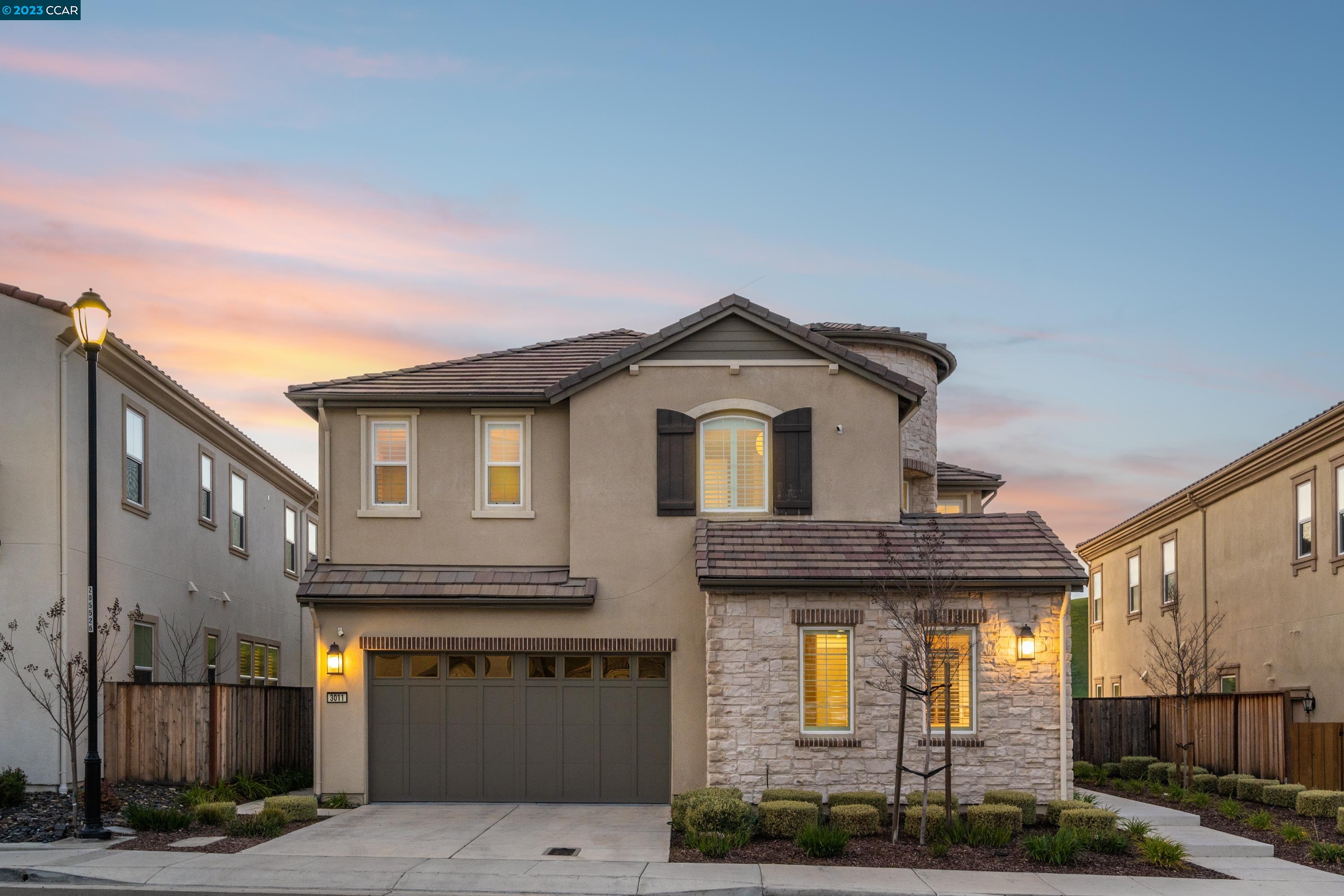 a front view of a house with garage