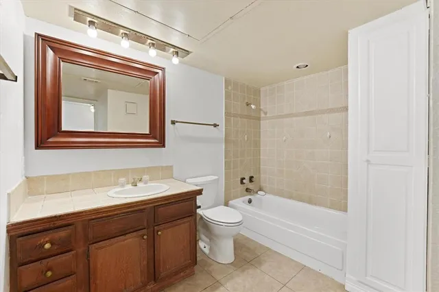a bathroom with a toilet a sink and a bathtub