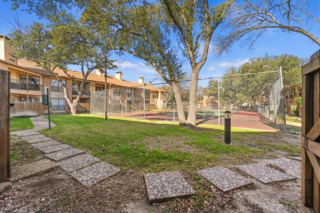 16301 Ledgemont Lane, Unit 109 Addison, TX 75001 - Photo 26 of 32 a view of a yard with a house