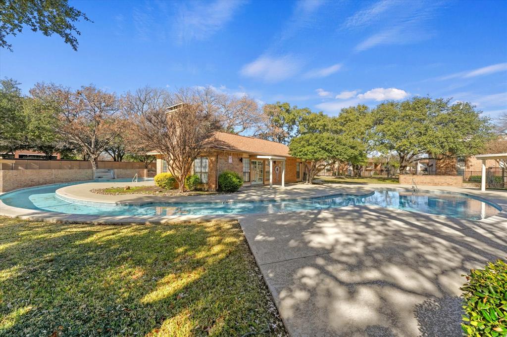 16301 Ledgemont Lane, Unit 109 Addison, TX 75001 - Photo 28 of 32 a view of swimming pool with a yard