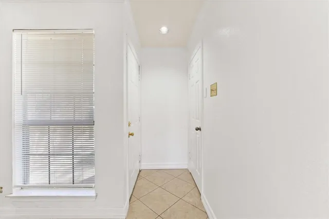 a view of hallway with windows