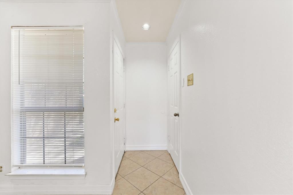 16301 Ledgemont Lane, Unit 109 Addison, TX 75001 - Photo 6 of 32 a view of hallway with windows